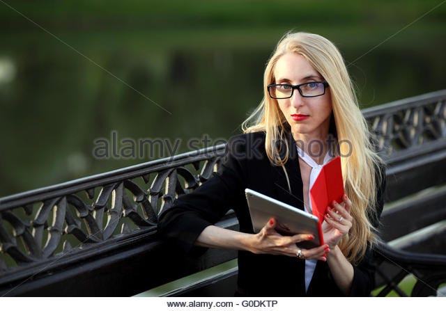 young business woman on a bench