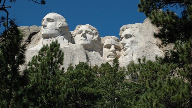 A view of Mount Rushmore into which are carved the images of four U.S. presidents, George Washington, Thomas Jefferson, Theodore Roosevelt and Abraham Lincoln.