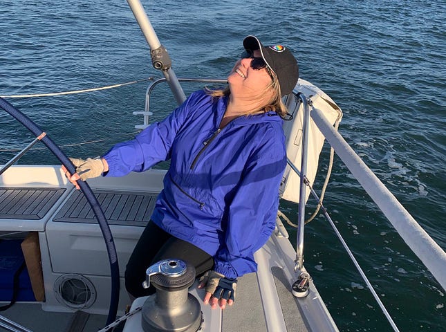 Author at the helm of Josie, a 39' Dehler sloop she often sails in SF Bay