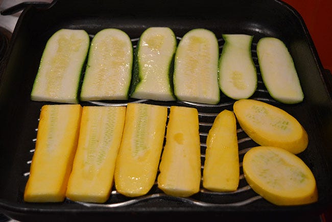 Zucchini slices on griddle pan.