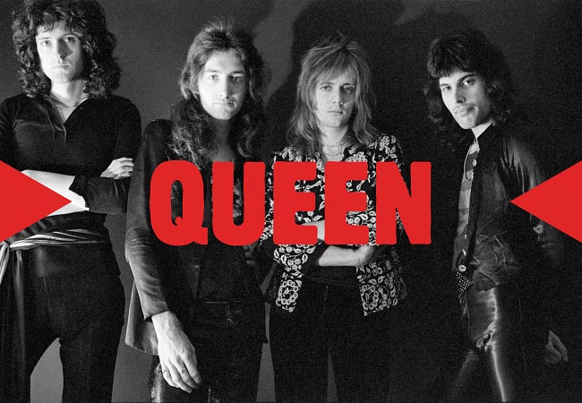 All four of the members of Queen in photo with their band name across the front in big red letters