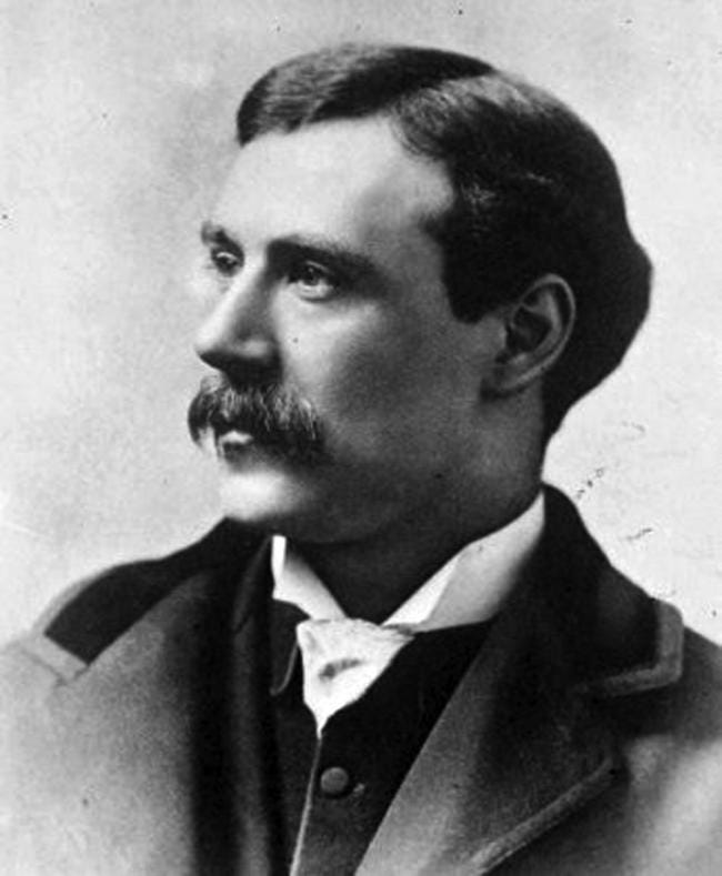 A Victorian photograph, a portrait of a white man with a moustache and short hair.