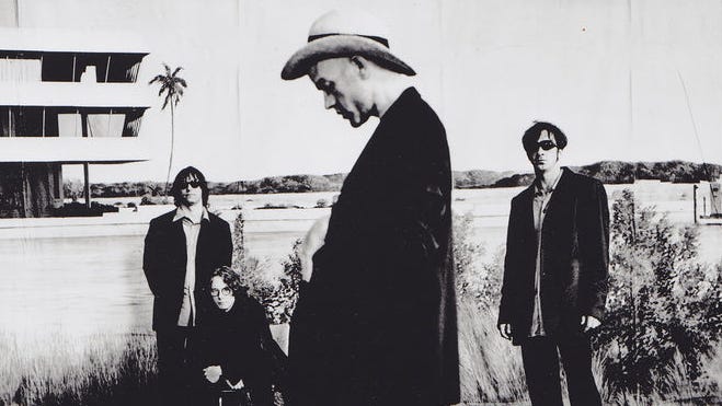 Publicity photo for New Adventures in Hi-Fi. Photo credit: Anton Corbijn. Copyright 1996 Warner Brothers Records.