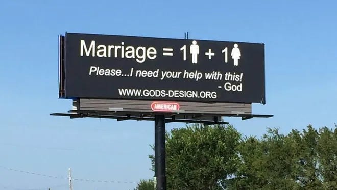Black billboard reading “Marriage = 1 (man stick figure) + 1 (woman stick figure). Please…I need your help with this! — God” ending with a link to gods-design dot org.