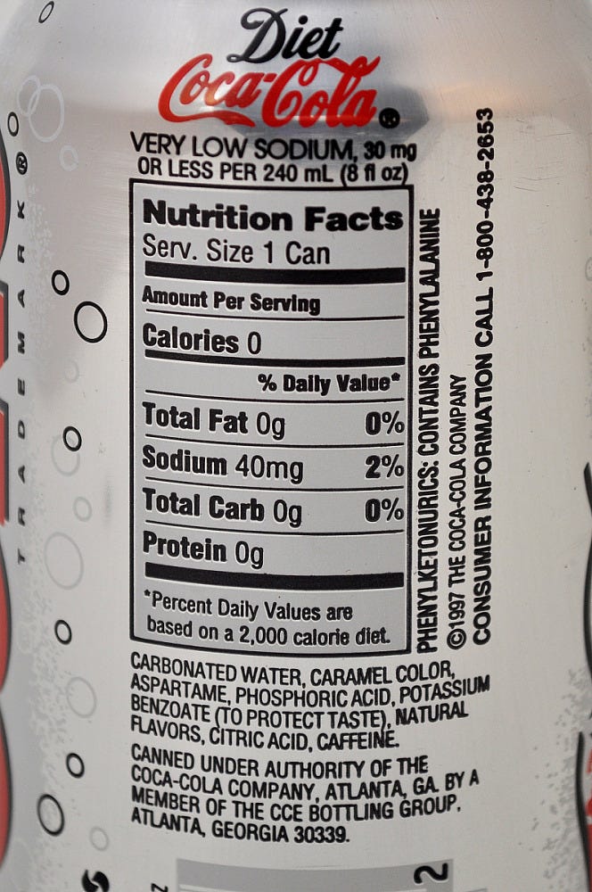A close up of the nutrition and ingredients in a Diet Coke can