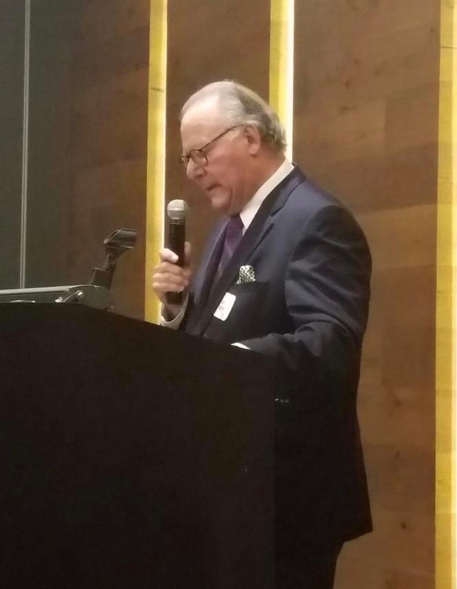 Adolfo Autrey welcoming guests at a Northwestern-Kellogg Event