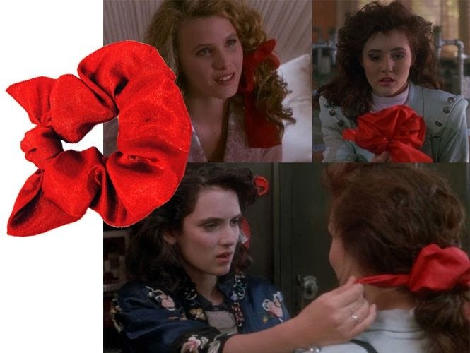 All of the Heathers, from the movie Heathers, wearing a red scrunchie.