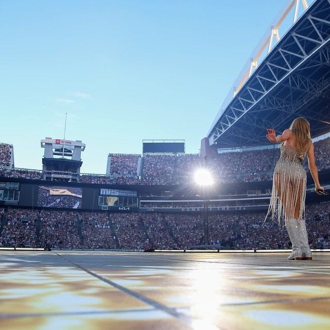 Taylor Swift in a sold out stadium Eras Tour concert