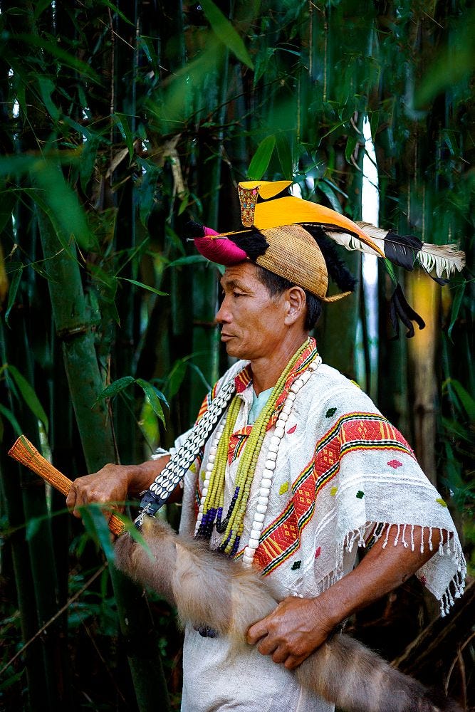 Nyishi tribe men wearing headgear made of hornbill beak