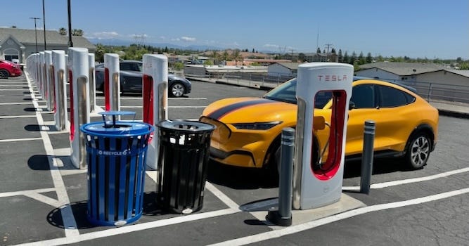 The EV parked next to a stall that’s oriented lengthwise to the car