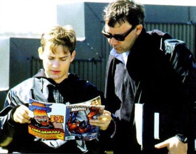 Director Sam Raimi and Tobey Maguire on set reading an issue of Ultimate Spider-Man