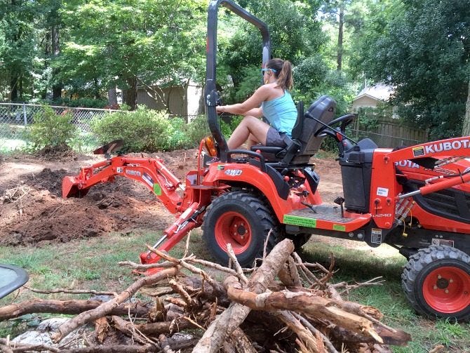 digging-up-tree-roots-with-backhoe