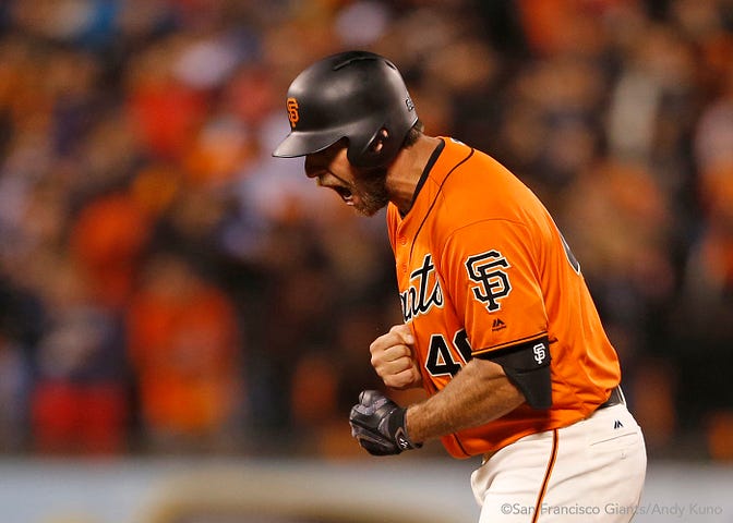 Madison Bumgarner reacts after doubling in the sixth inning.