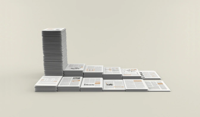 A row of stacks of paper placed side by side; the one on the left in the back row is much taller than the others.