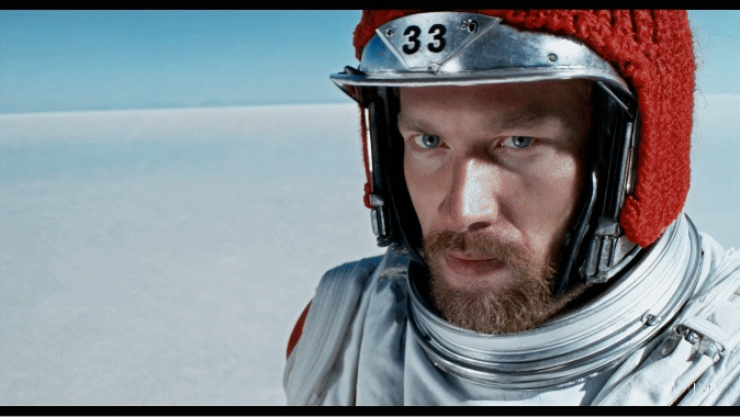 Prompt: A movie trailer featuring the adventures of the 30 year old space man wearing a red wool knitted motorcycle helmet, blue sky, salt desert, cinematic style, shot on 35mm film, vivid colors.