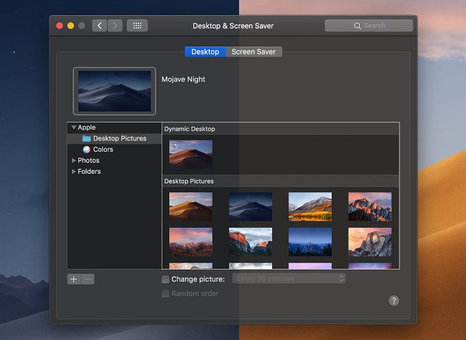 Two screenshots, split vertically, of the System Preferences window in dark mode in macOS Mojave, with different wallpapers behind. The left half uses a wallpaper with dark blue tones. The right half uses a wallpaper with lighter orange tones. The window has a different background color that’s slightly tinted to match the colors of the wallpapers.