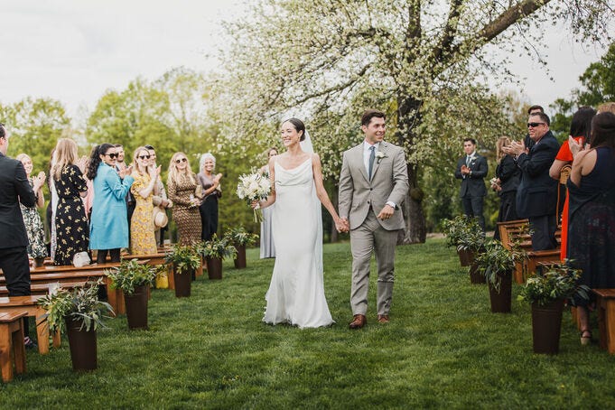 Bride and groom at a 2021 ceremony that was postponed from a 2020 Covid Wedding.