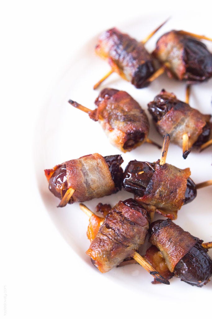 white plate of bacon wrapped dates
