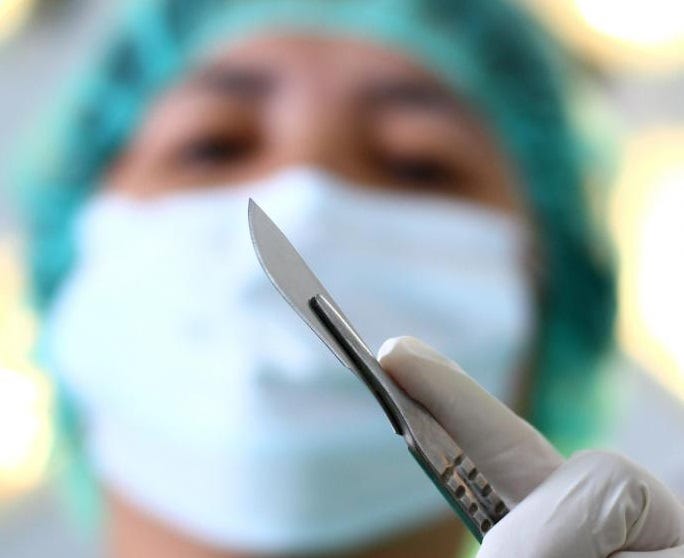 Image showing a Surgeon holding a scalpel