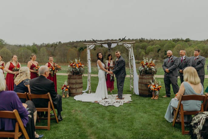 Bride and groom at a 2022 ceremony that was postponed from a 2020 Covid Wedding.