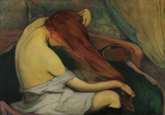 Portrait of a woman combing her hair.