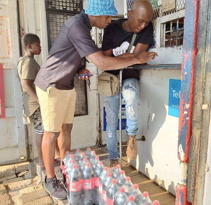 Kweza founder interacting with a customer