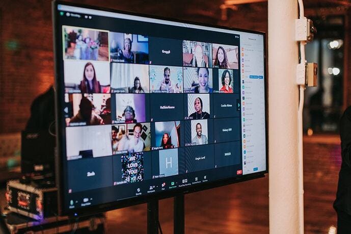 Computer monitor displays guests attending via Zoom at a 2020 Covid Wedding.