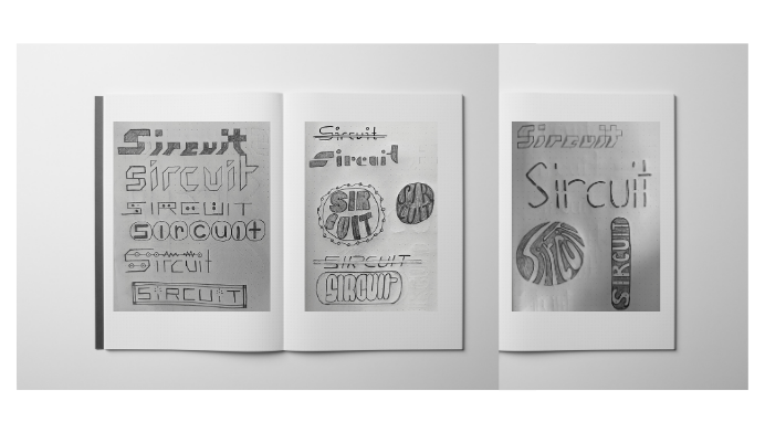 Image of notebook mockup with second round of logo sketches