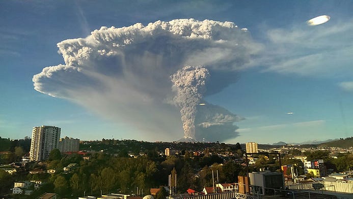 A volcano erupting in Chile near a city