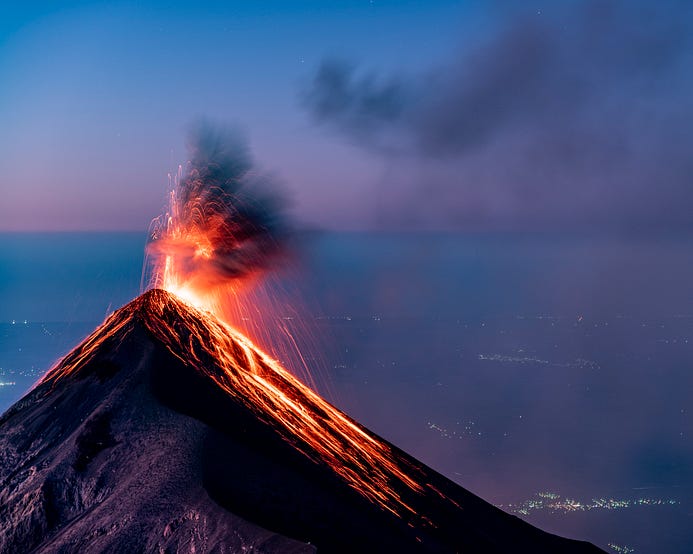 A volcano spewing out sparks and lava