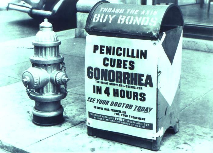 This was one of the posters that had been commissioned by the United States government in order to spread the word to its servicemen that interacting with prostitutes in an intimate manner could put one in harm’s way for acquiring a sexually transmitted disease (STD). Attached to a curbside mailbox, this poster stated, “PENICILLIN CURES GONORRHEA, THE GREAT CRIPPLER AND STERILIZER, IN 4 HOURS; SEE YOUR DOCTOR TODAY; HE NOW HAS PENICILLIN FOR YOUR TREATMENT; THE DRUG IS FURNISHED FREE”
