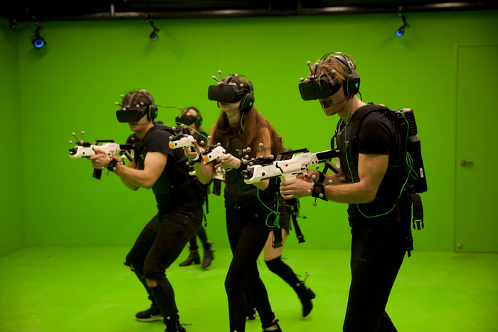 Image of people playing a VR videogame together.