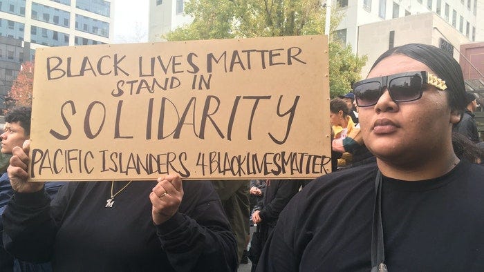 a sign from the black lives matters protest saying “black lives matter stand in solidarity pacific islanders 4BLM