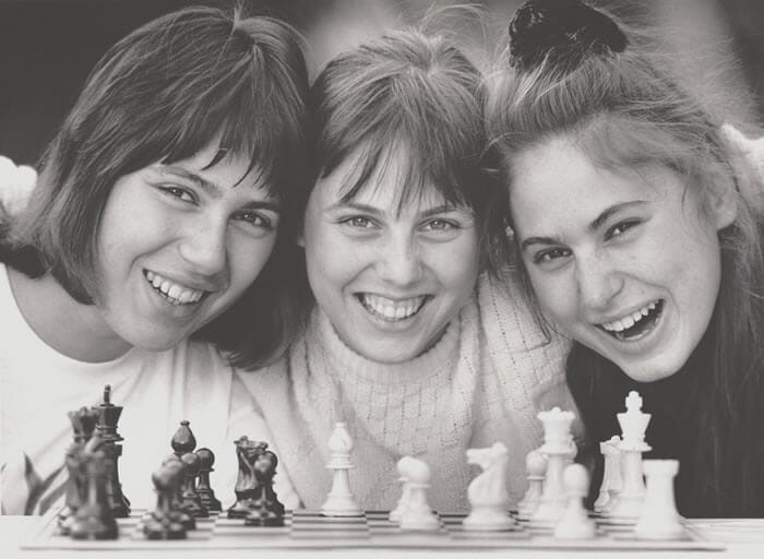 The Polgar sisters, Susan, Sofia and Judit posed together for a picture with a chess board in front of them