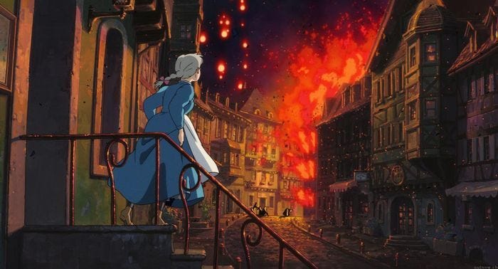 a woman staring at a city on fire