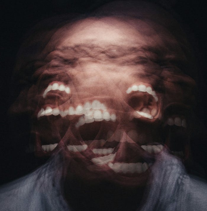 Multi-exposure of man shaking his head, screaming