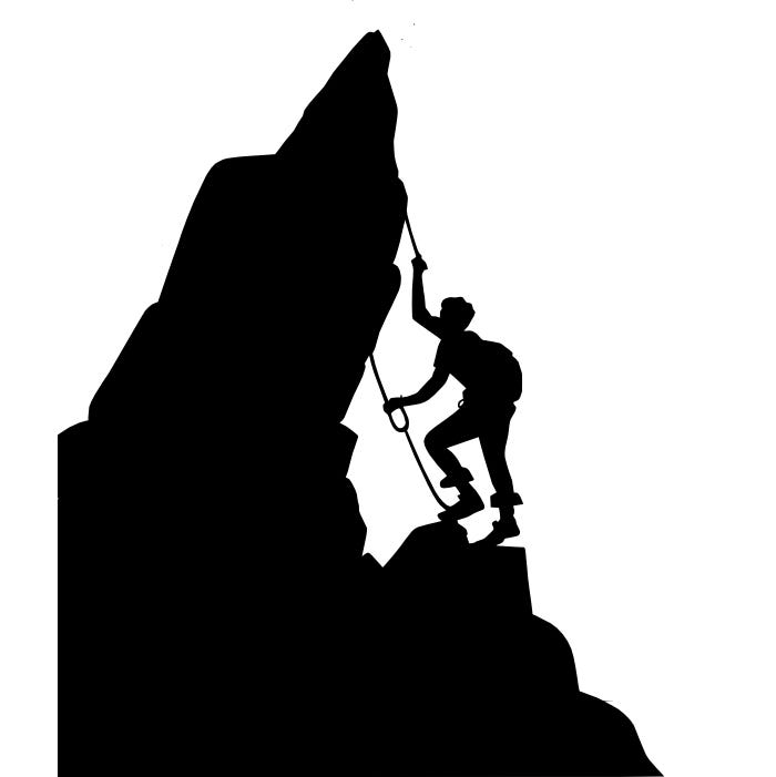 Image of a climber midway up a challenging but manageable rock, visibly engaged and determined.