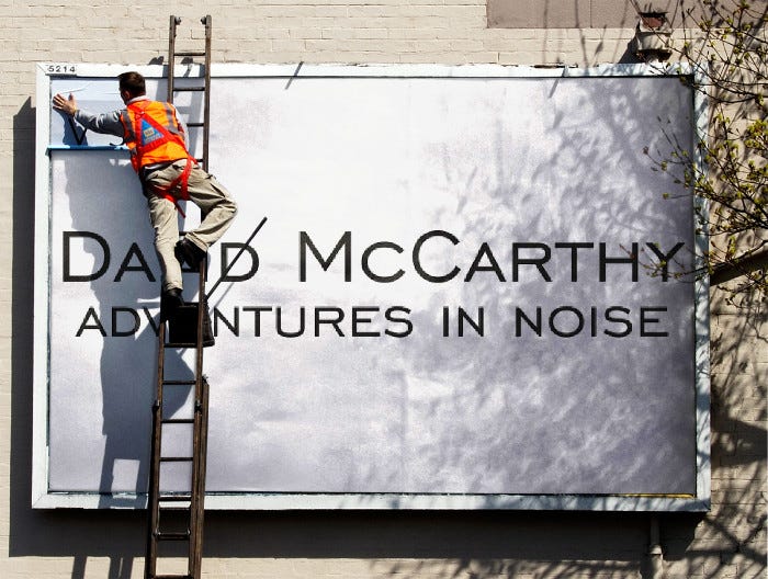 Street billboard poster being put up for David McCarthy’s Adventures in Noise