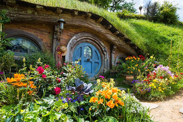 An image of the Shire tourist attraction from https://www.aboutnewzealand.com/blog/the-shire-hobbiton-private-tour/