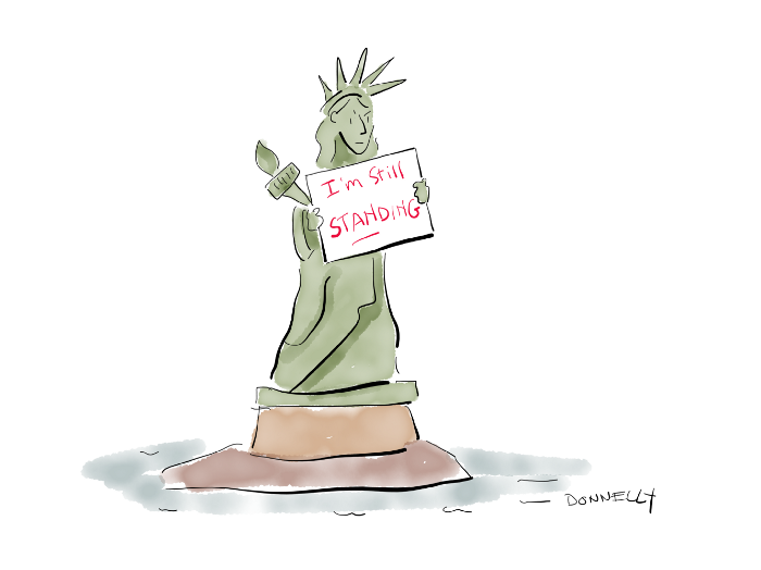 Lady Liberty holding a placard that says, I’m still standing. Cartoon by Liza Donnelly. Used with permission.