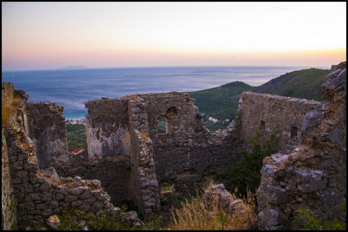 Overlooking Himare, Albania, the remains of a castle carved out of the hill and multiple churches carved out of the castle's remains. So Stendahl, no?
