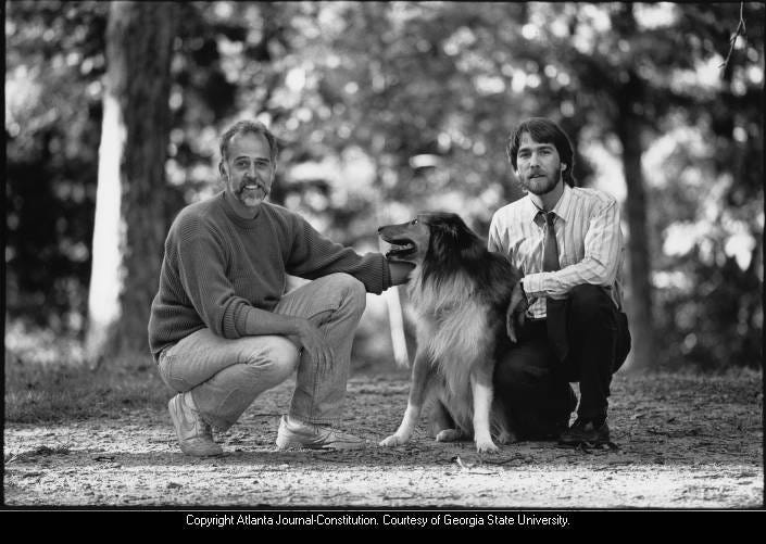 Gay couple William Bill Gripp and Michael Wilson take a walk in Candler Park with their collie Harry. See the original item at Georgia State University Library digital collections.