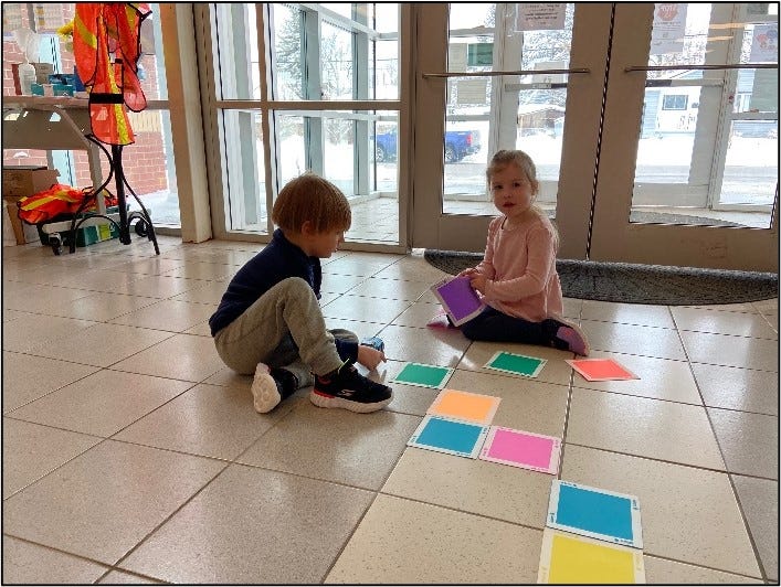 Two students working with the Sphero Indi