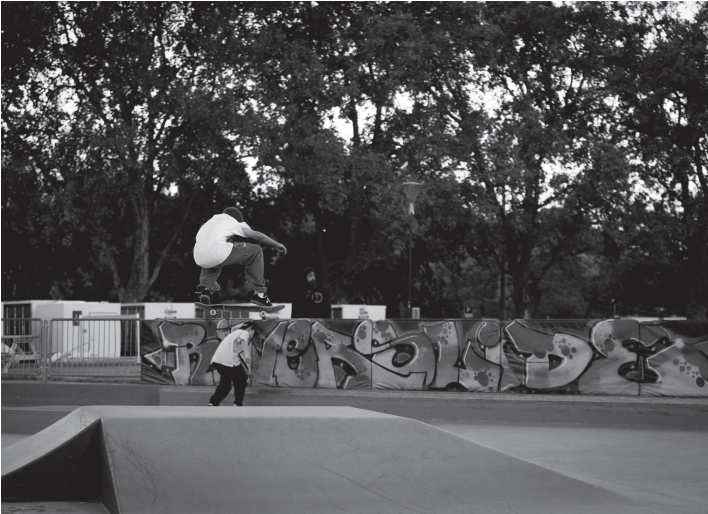 Boy doing skateboard trick. Photo by Gabriel Murdoch