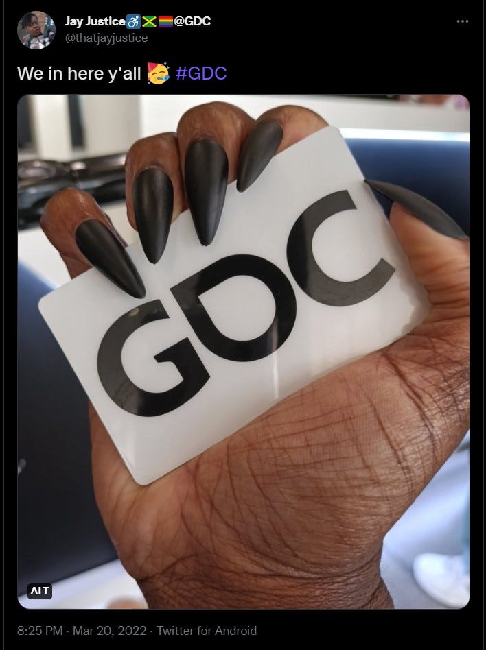tweet from Jay Justice wheelchair emoji @GDC recovery  @thatjayjustice  We in here y’all party emoji embedded image is the hand of a dark-skinned Black woman with long black stiletto nails holding a white plastic card that says GDC on it in black text #GDC  8:25 PM · Mar 20, 2022·Twitter for Android