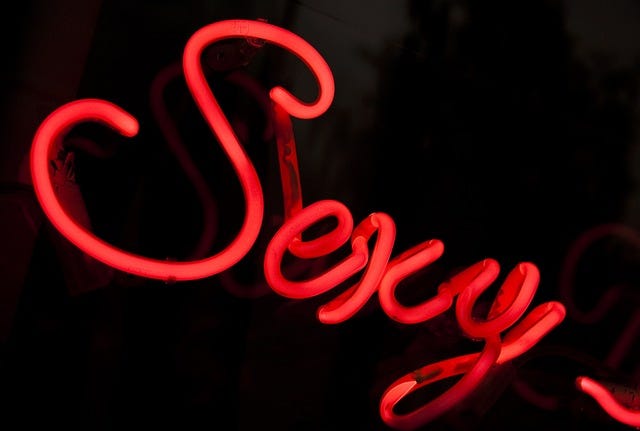 The word Sexy in curly script, red neon lights