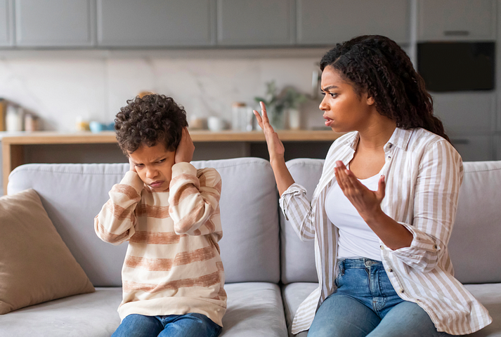 A stubborn kid not listening to his desperate mom.