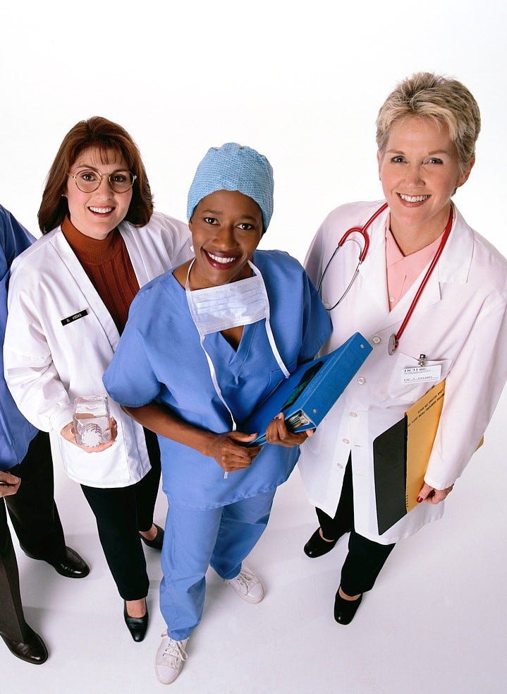 Three women physicians standing together