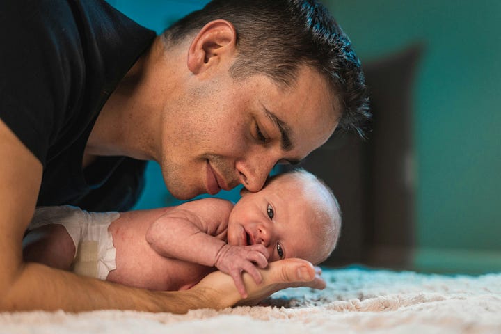 A man holding a baby.