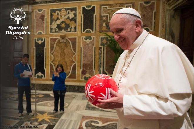 Pope Francis smiles with the iconic Special Olympics Unified Ball during a ceremony in Rome with Special Olympics Italy athletes prior to the 2015 Special Olympics World Summer Games in Los Angeles. 
